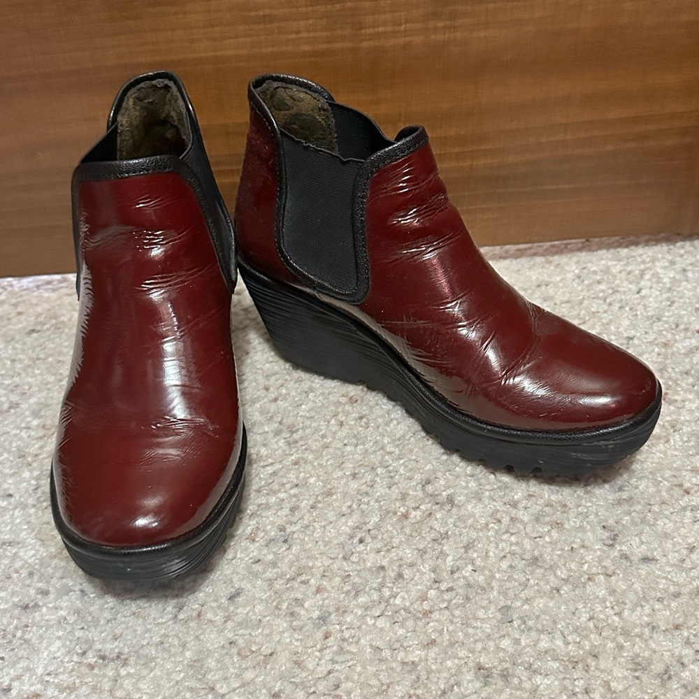 Fly London Wedge Booties in a dark red patent.